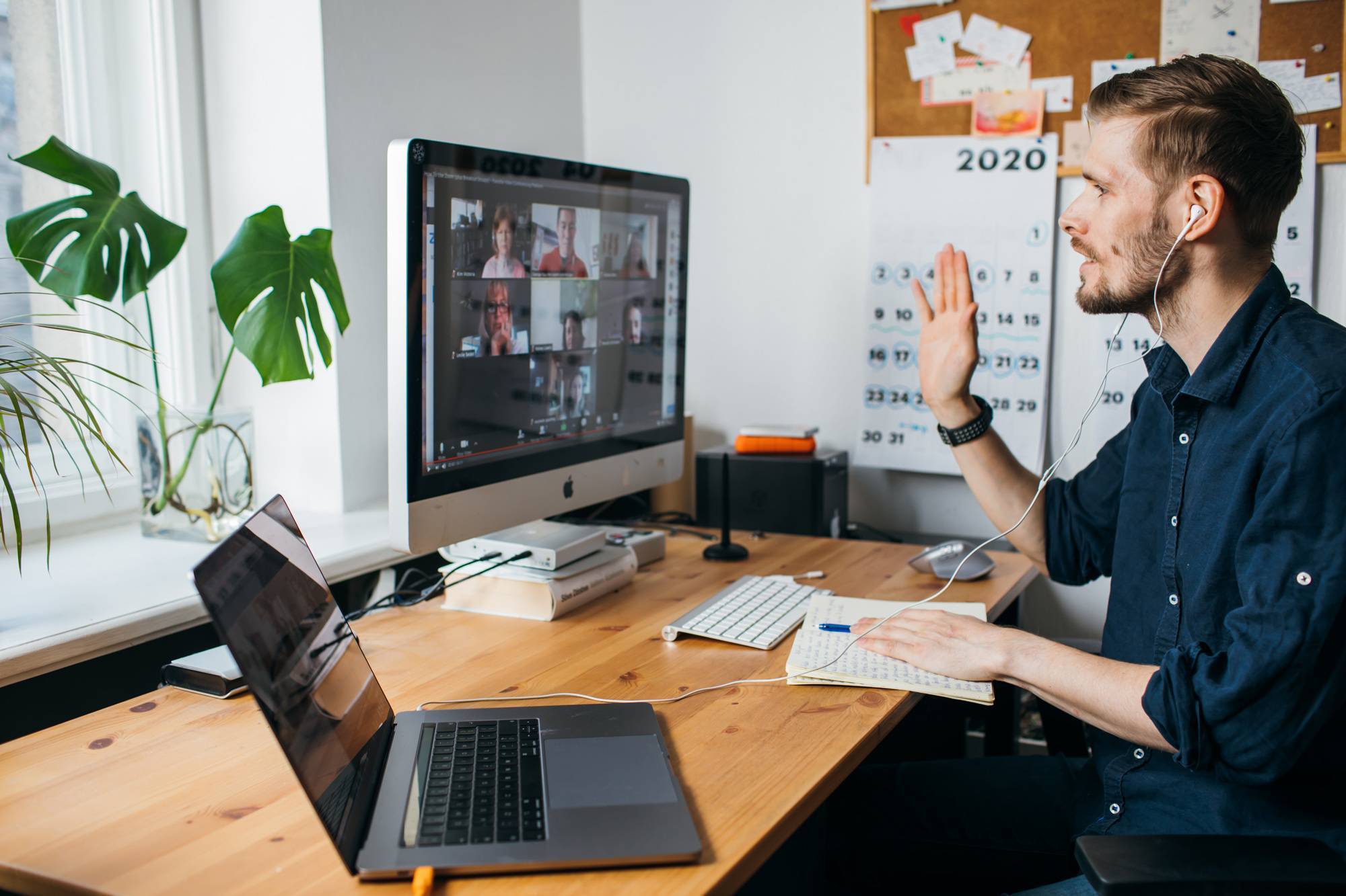 Young man on video conferencing call via computer at home office.