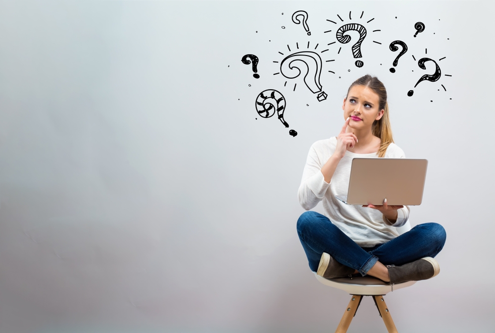 Question,Marks,With,Young,Woman,Using,Her,Laptop,On,A