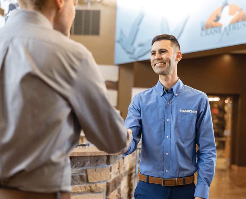 Hamilton employee, shaking hands with a client