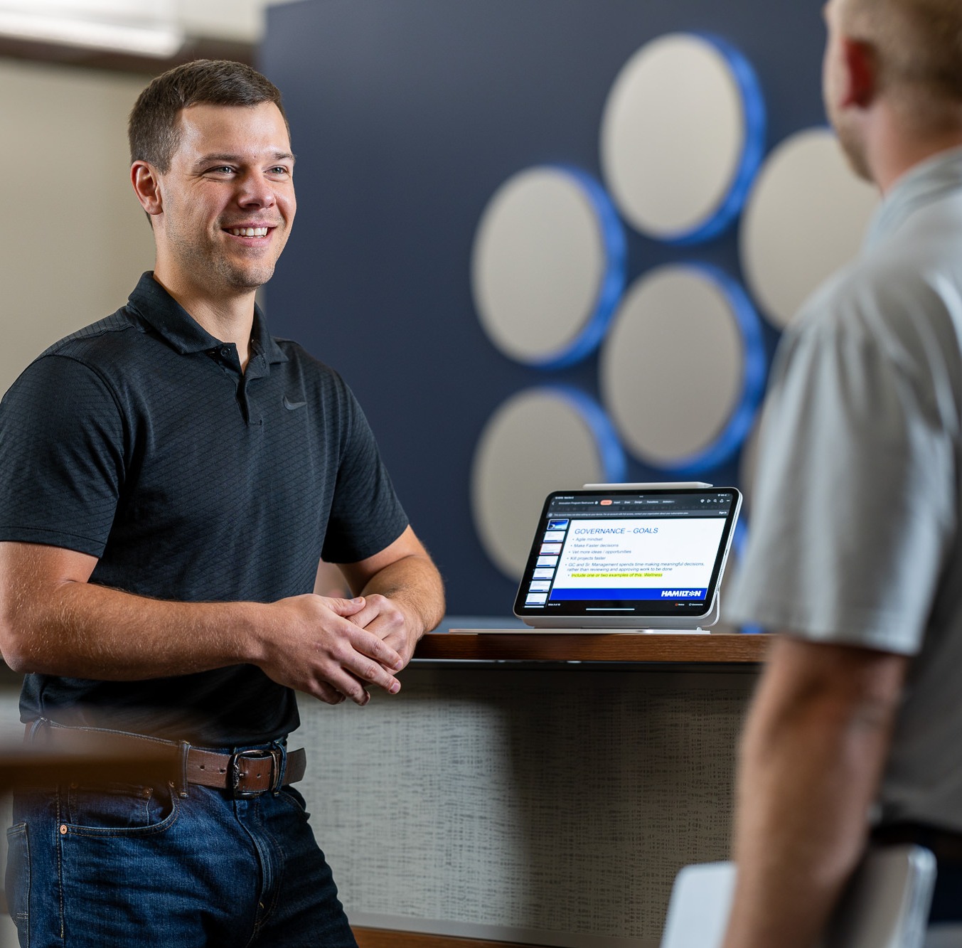 Hamilton Managed IT manager meeting with client in Aurora front office