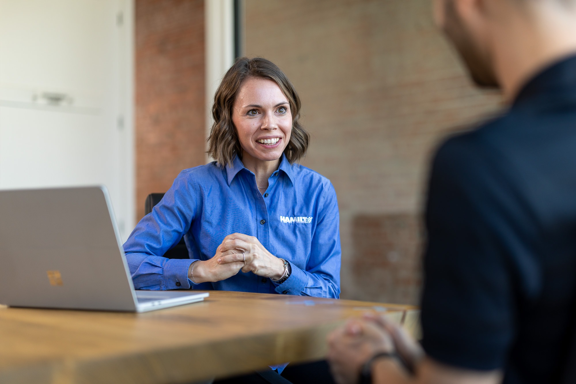 Hamilton Sales woman meeting with a client.