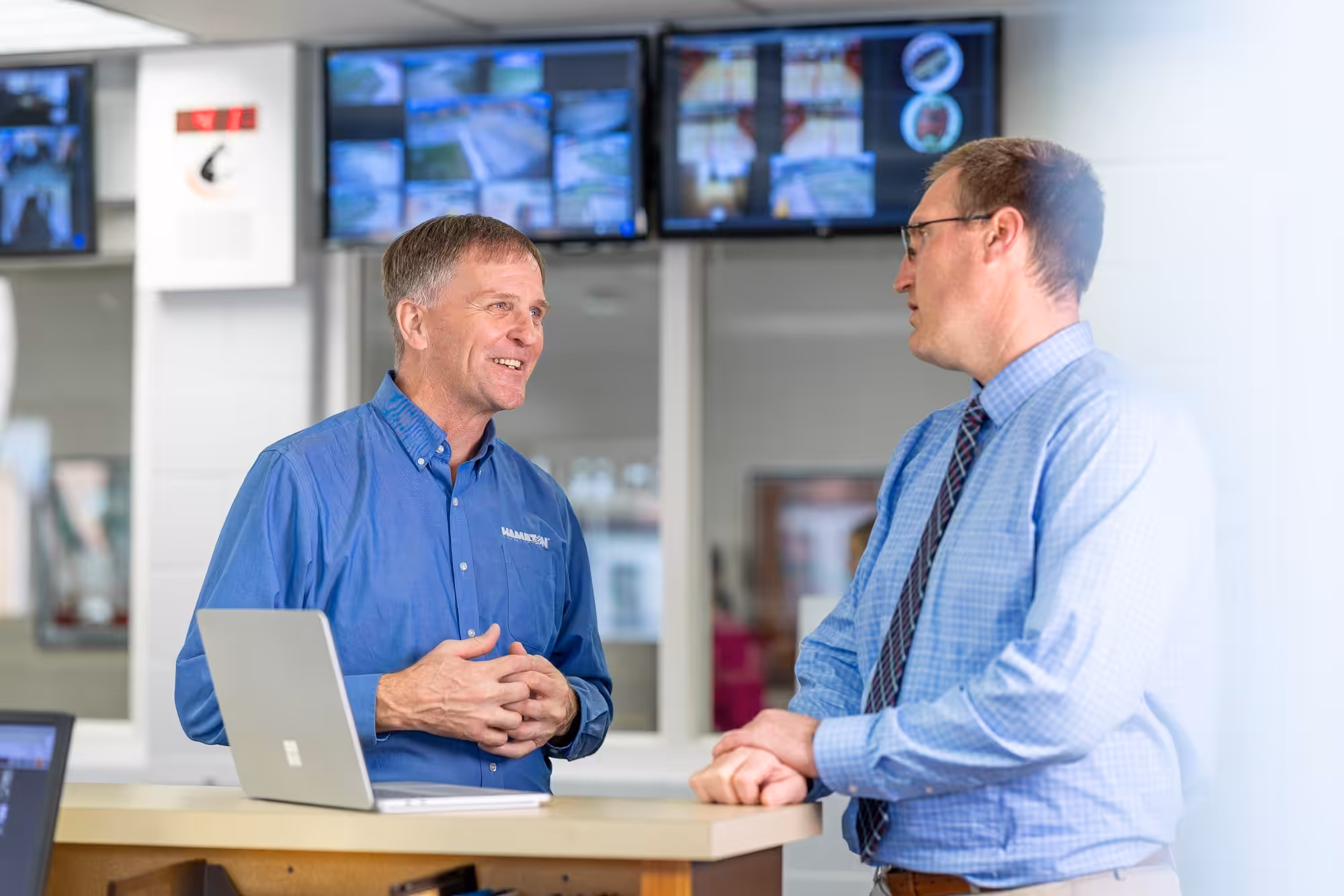 Hamilton Employee showing our security solutions monitoring software
