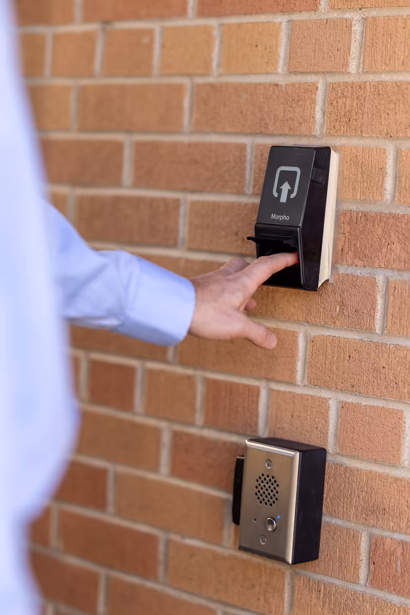 A man using a Hamilton fingerprint scanner