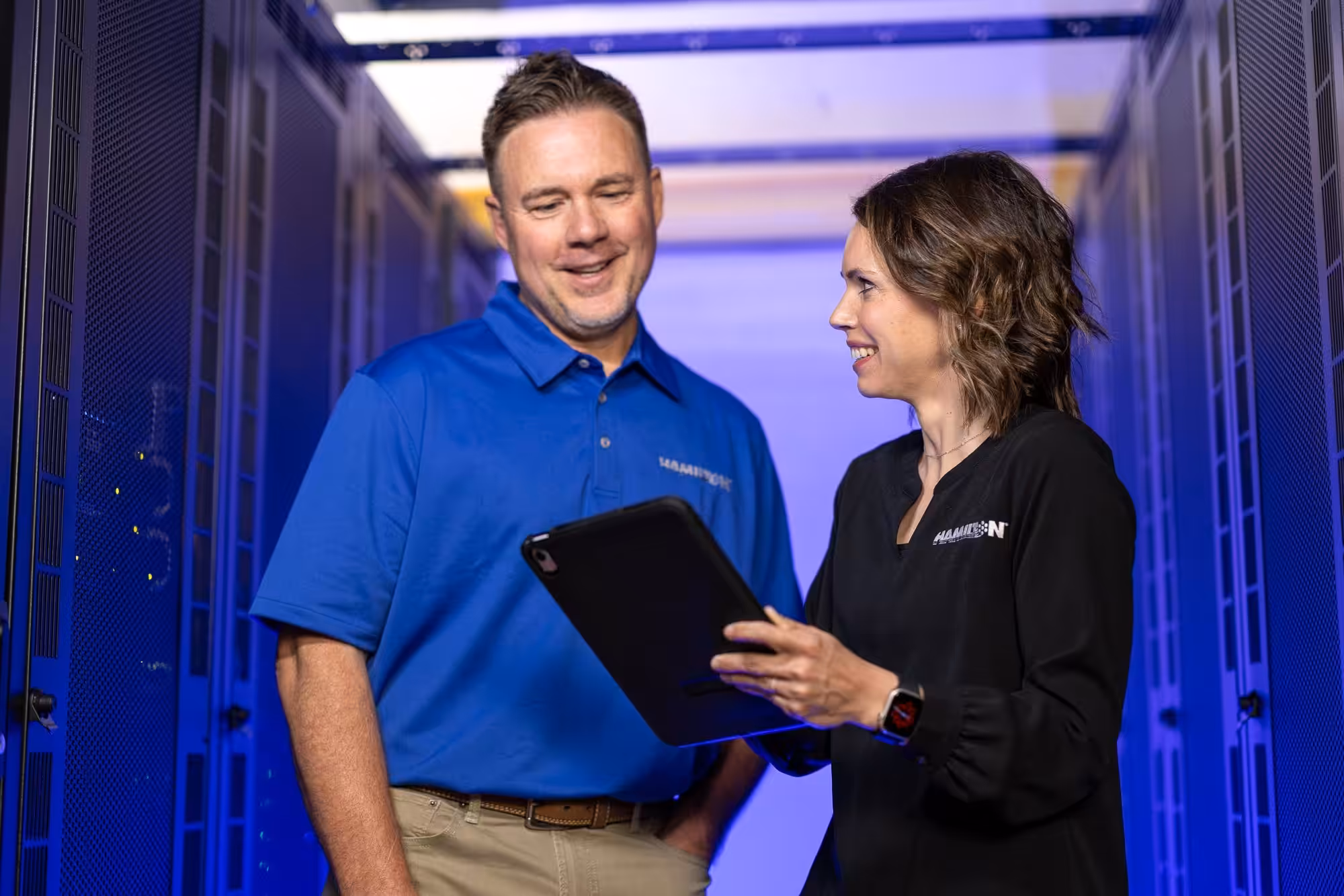 Hamilton techs in data center securing a network Hamilton techs in data center securing a network