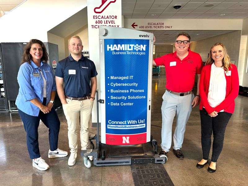 Hamilton employee's standing in from of metal detectors in memorial stadium in lincoln nebraska