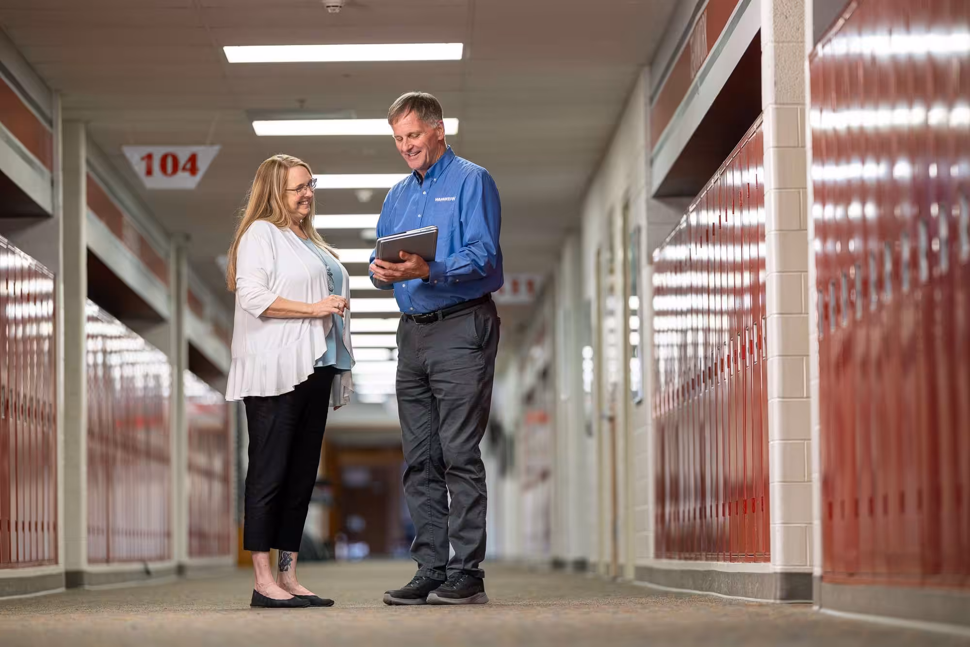 hamilton tech showing a school administrator Hamilton Education IT services in a school hallway