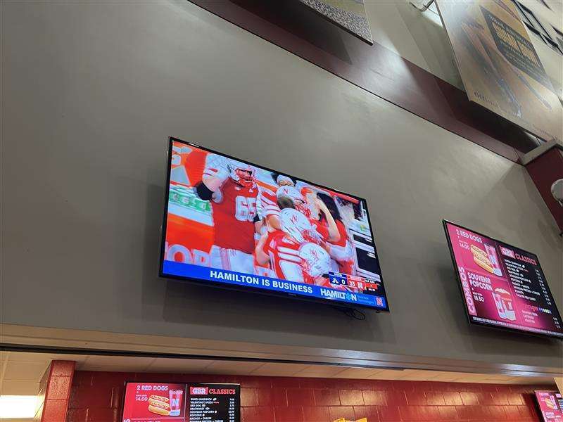 Hamilton Business Technologies ad on a TV in Memorial Stadium in lincoln nebraska