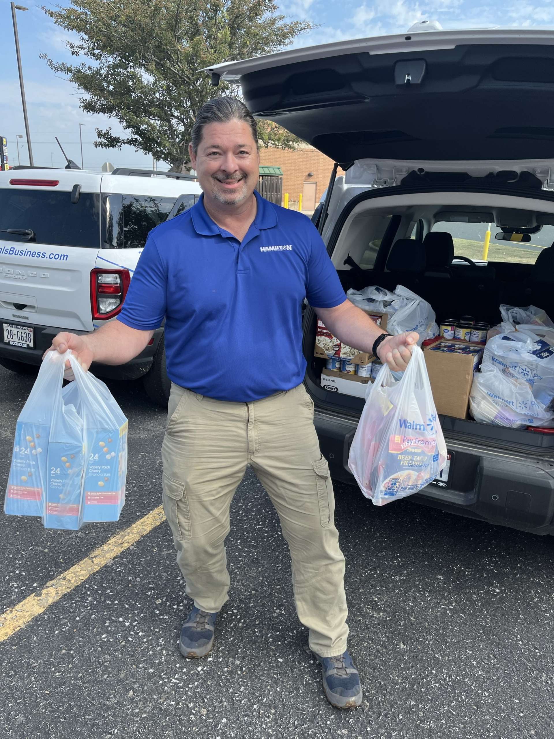 Hamilton tech serving with United Way Food Drive
