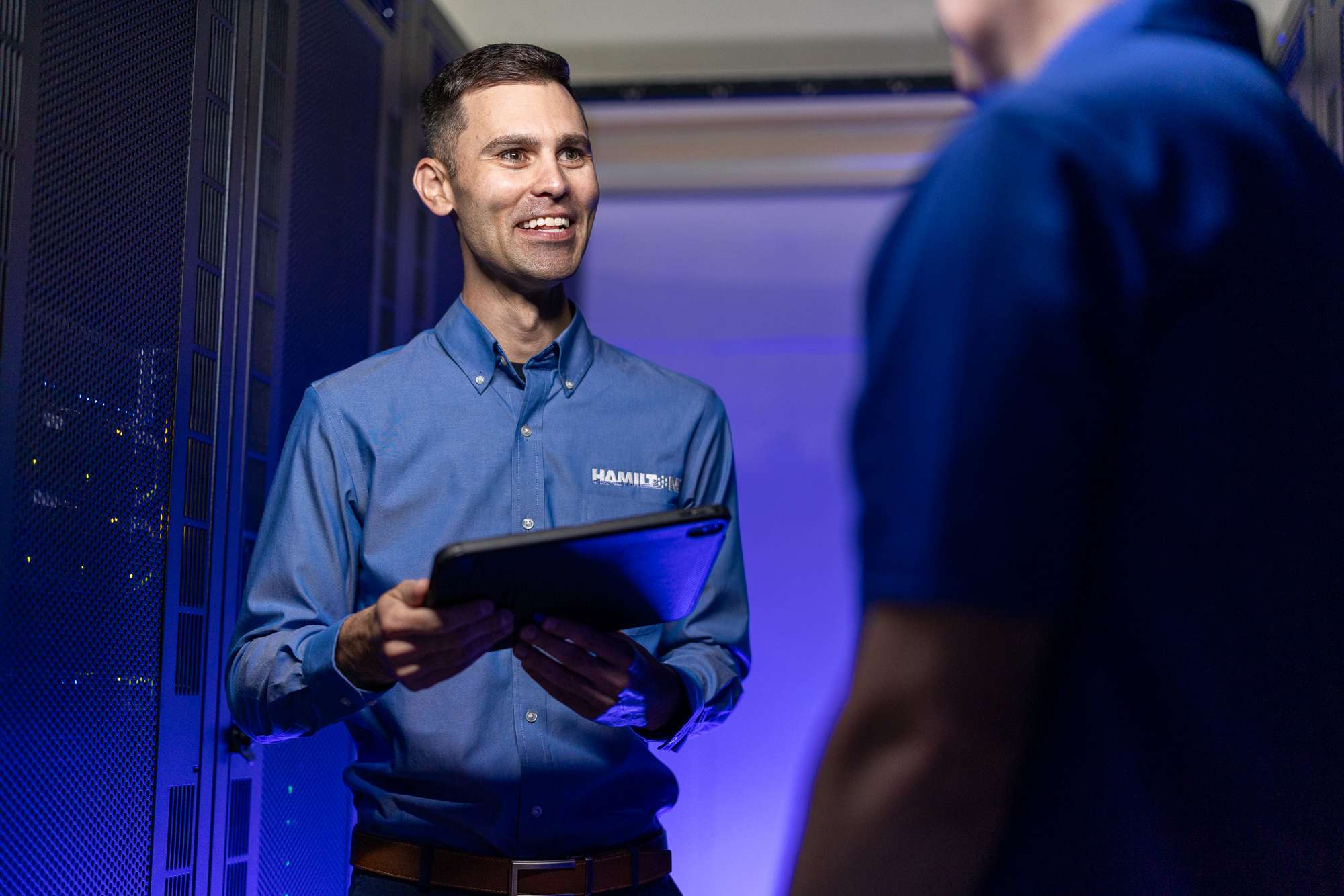 Hamilton Salesman displaying Hamilton's Managed IT solutions on an ipad