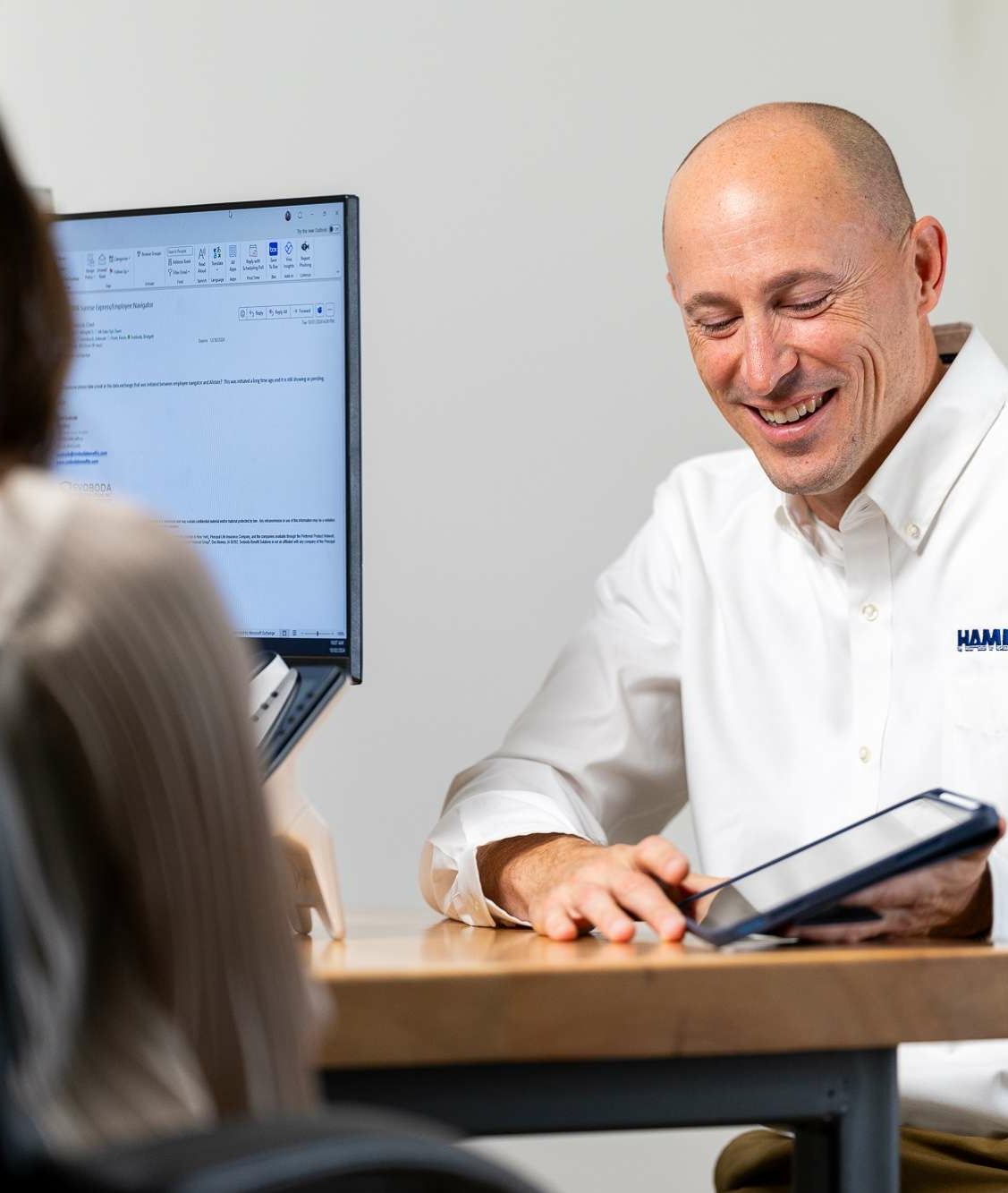 Hamilton Salesman displaying Hamilton's Managed IT solutions on an ipad