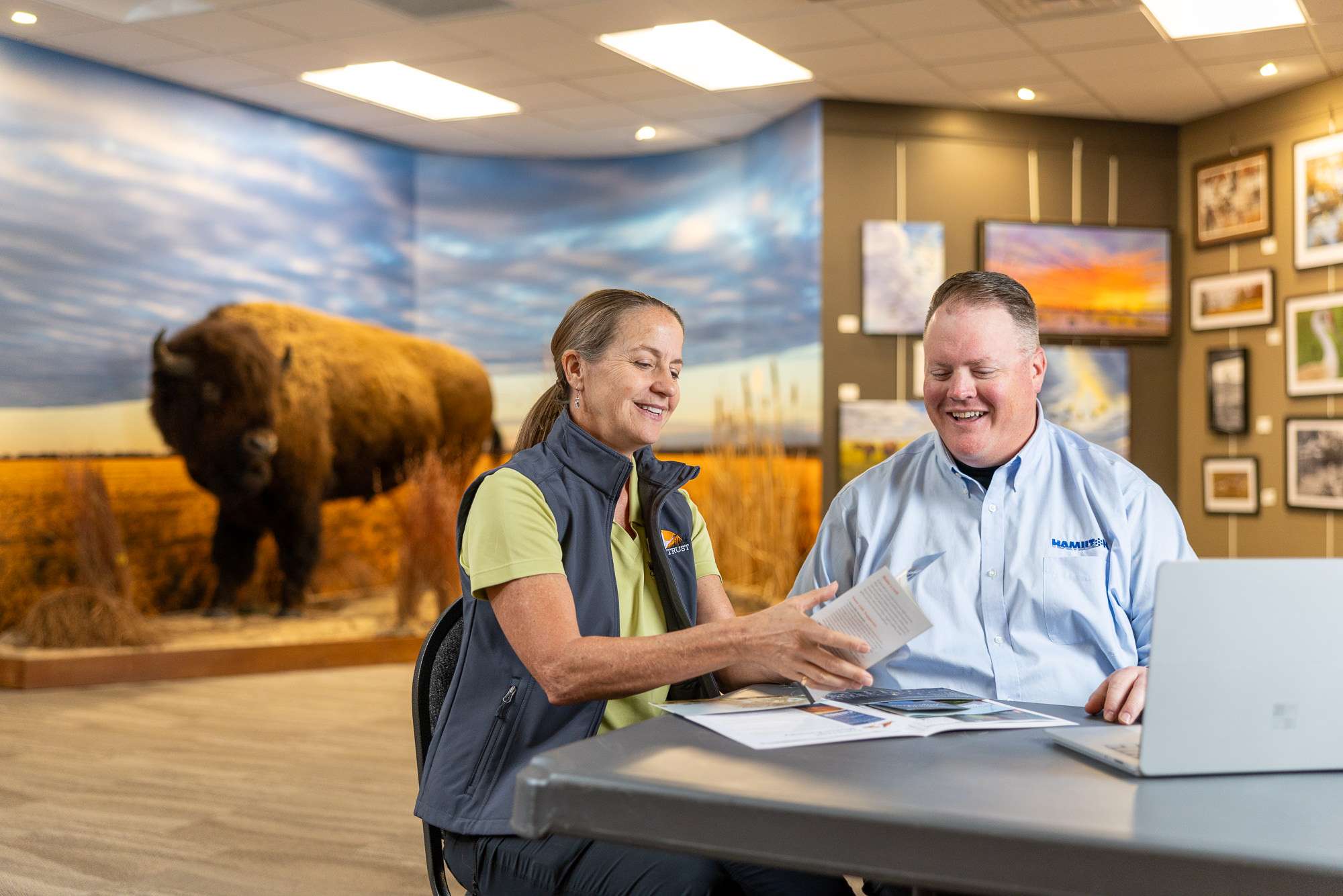 hamilton sales man sitting with a client going over our cybersecurity services