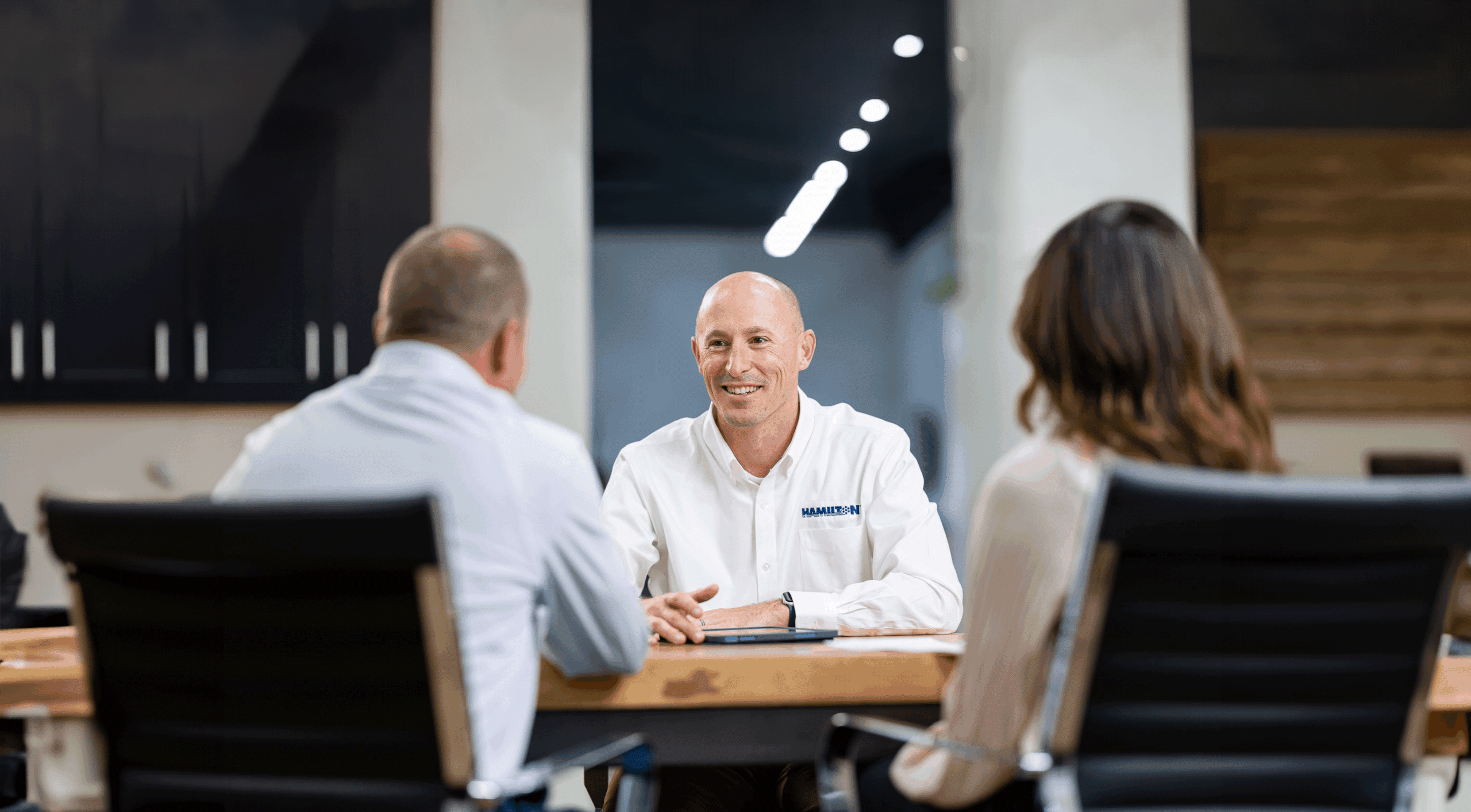 Hamilton Sales Manager meeting with clients about Hamilton Business Technologies managed IT services