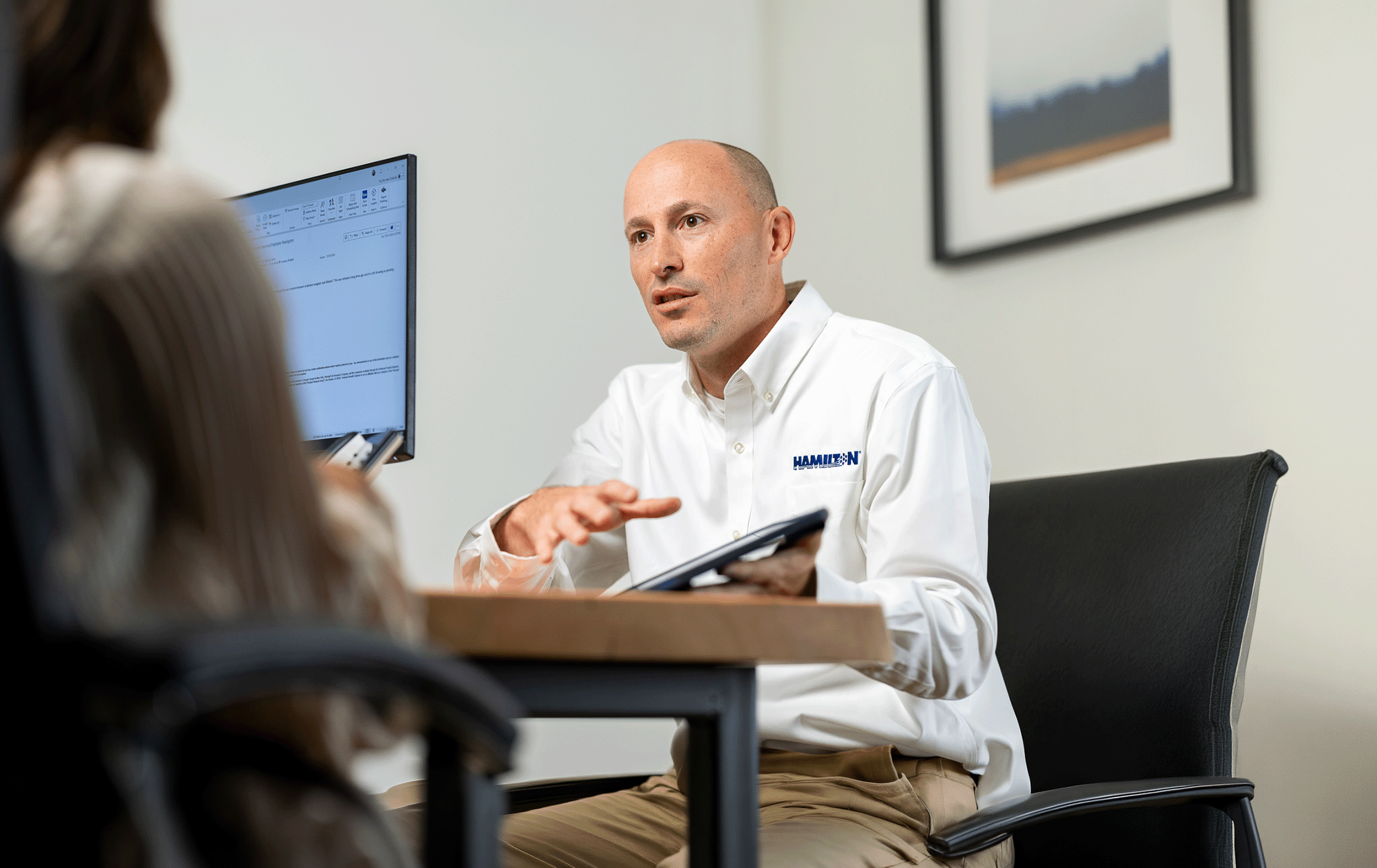 Hamilton sales rep meeting with a client showing potential business AI Solutions
